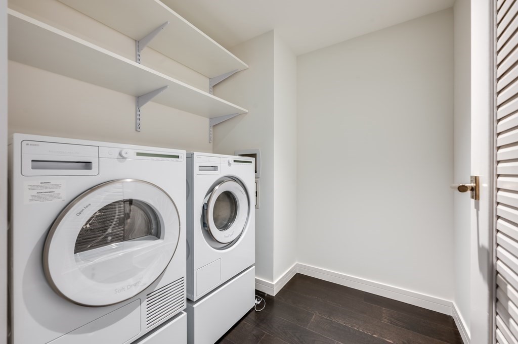 150 Seaport Boulevard, Unit 17D Boston, MA 02210 - Photo 13 of 24 a utility room with dryer and washer