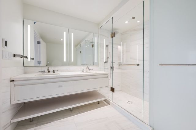 a white bath tub sitting in a en suite bathroom