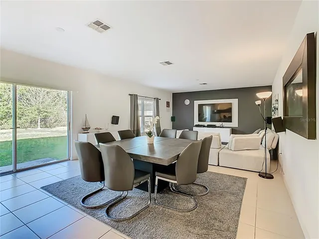 a view of kitchen with dining table and chairs