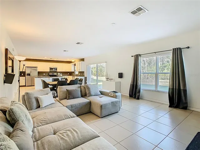 a view of a livingroom with stairs