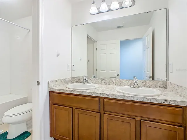 a bathroom with a shower and a toilet
