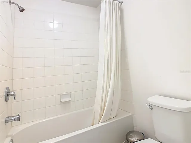 a bedroom with a bed and a closet