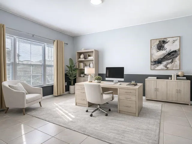 a view of an empty room with window and cabinet