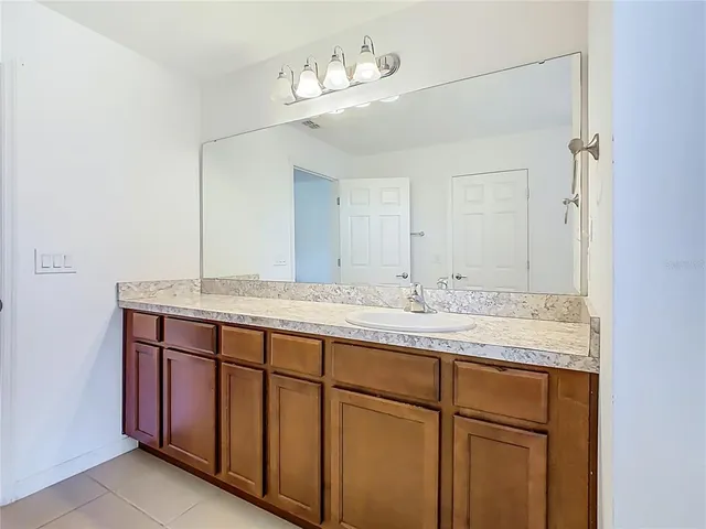 a bathroom with a glass door shower