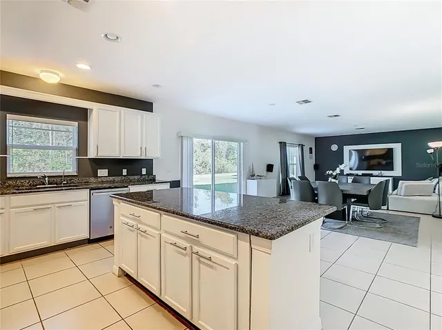 a kitchen with a stove microwave and cabinets