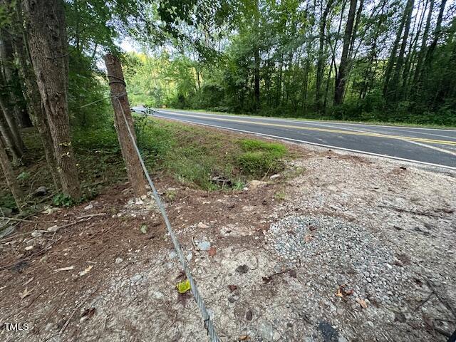 1101 Moss Road Zebulon, NC 27597 - Photo 6 of 22 a view of a yard with large trees