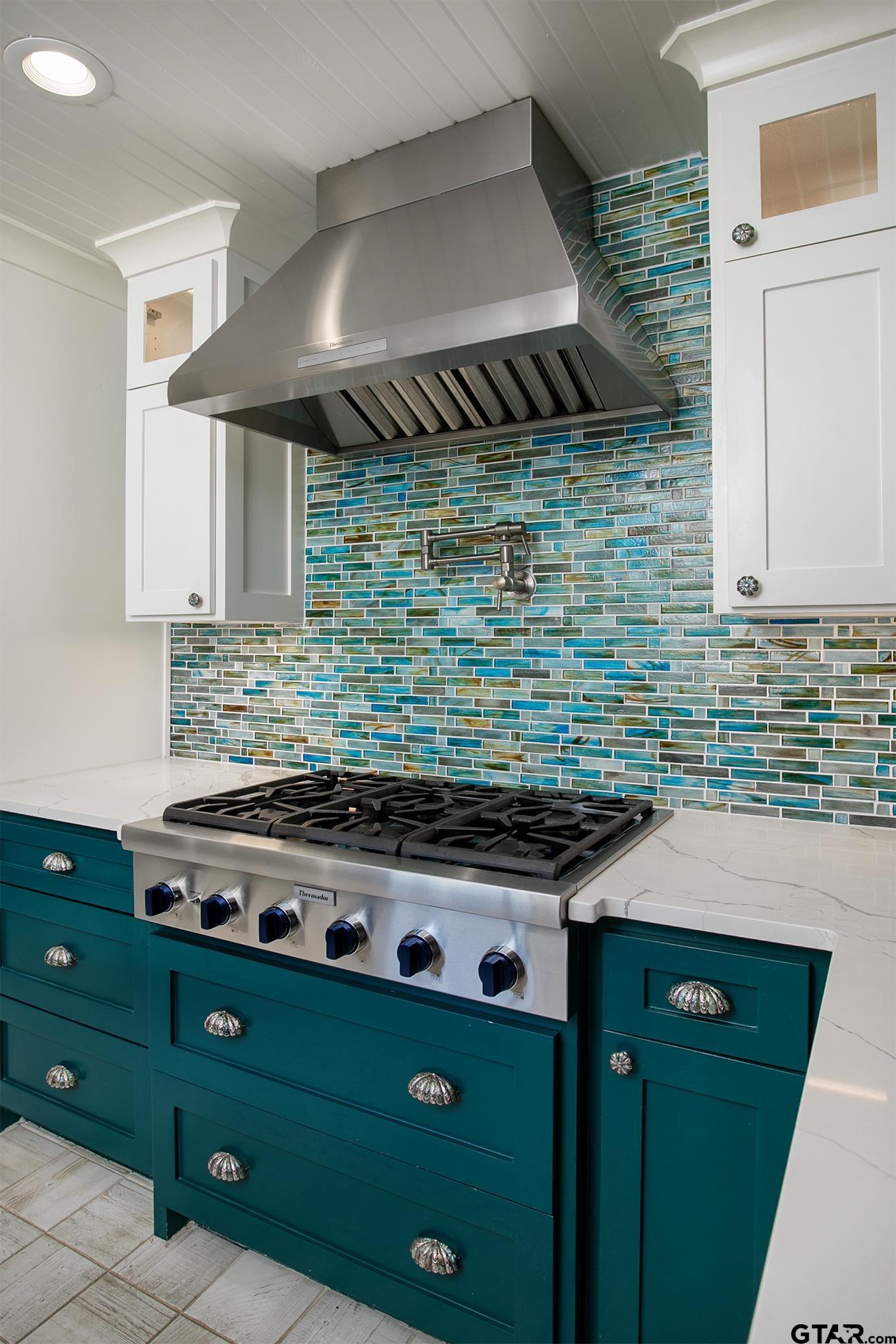 502 West Hubbard Street Lindale, TX 75771 - Photo 11 of 48 a kitchen with a sink stove and cabinets