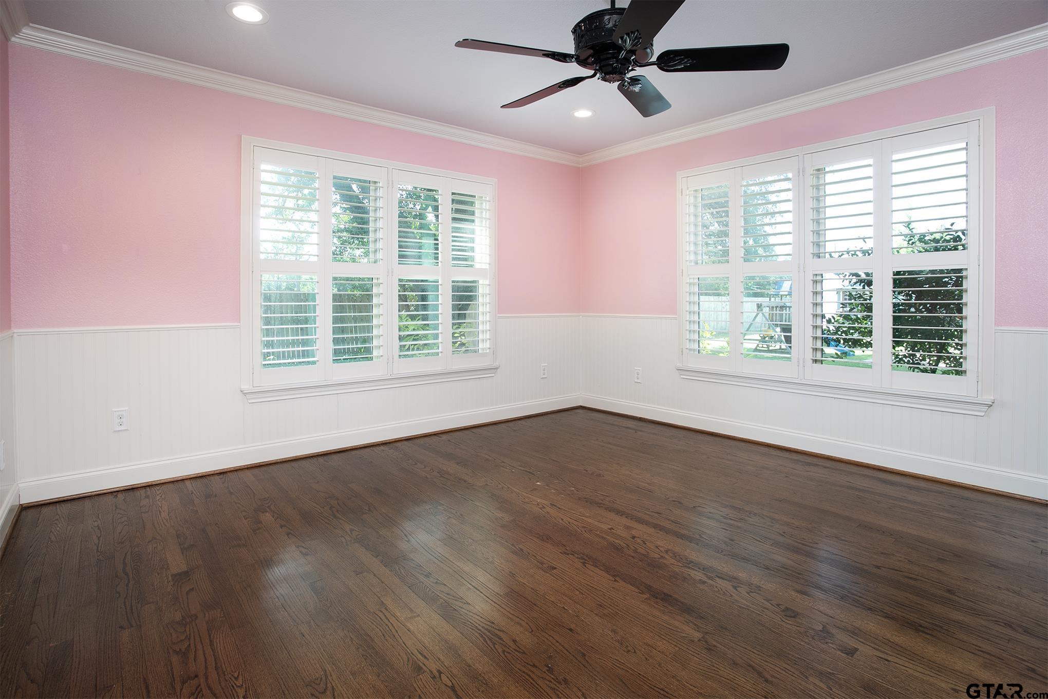 502 West Hubbard Street Lindale, TX 75771 - Photo 23 of 48 a view of an empty room with wooden floor and a window