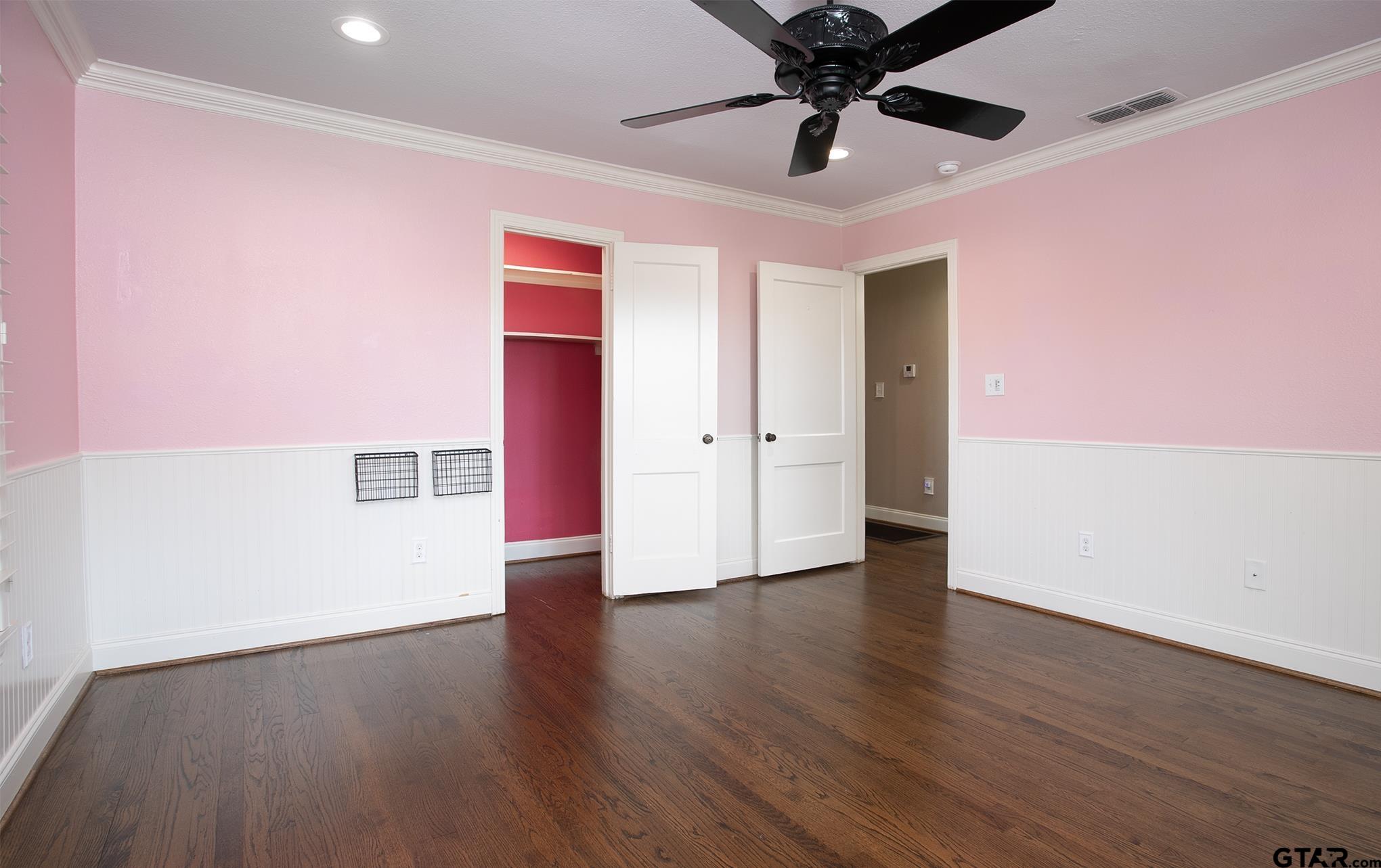 502 West Hubbard Street Lindale, TX 75771 - Photo 24 of 48 a view of an empty room with a window and wooden floor