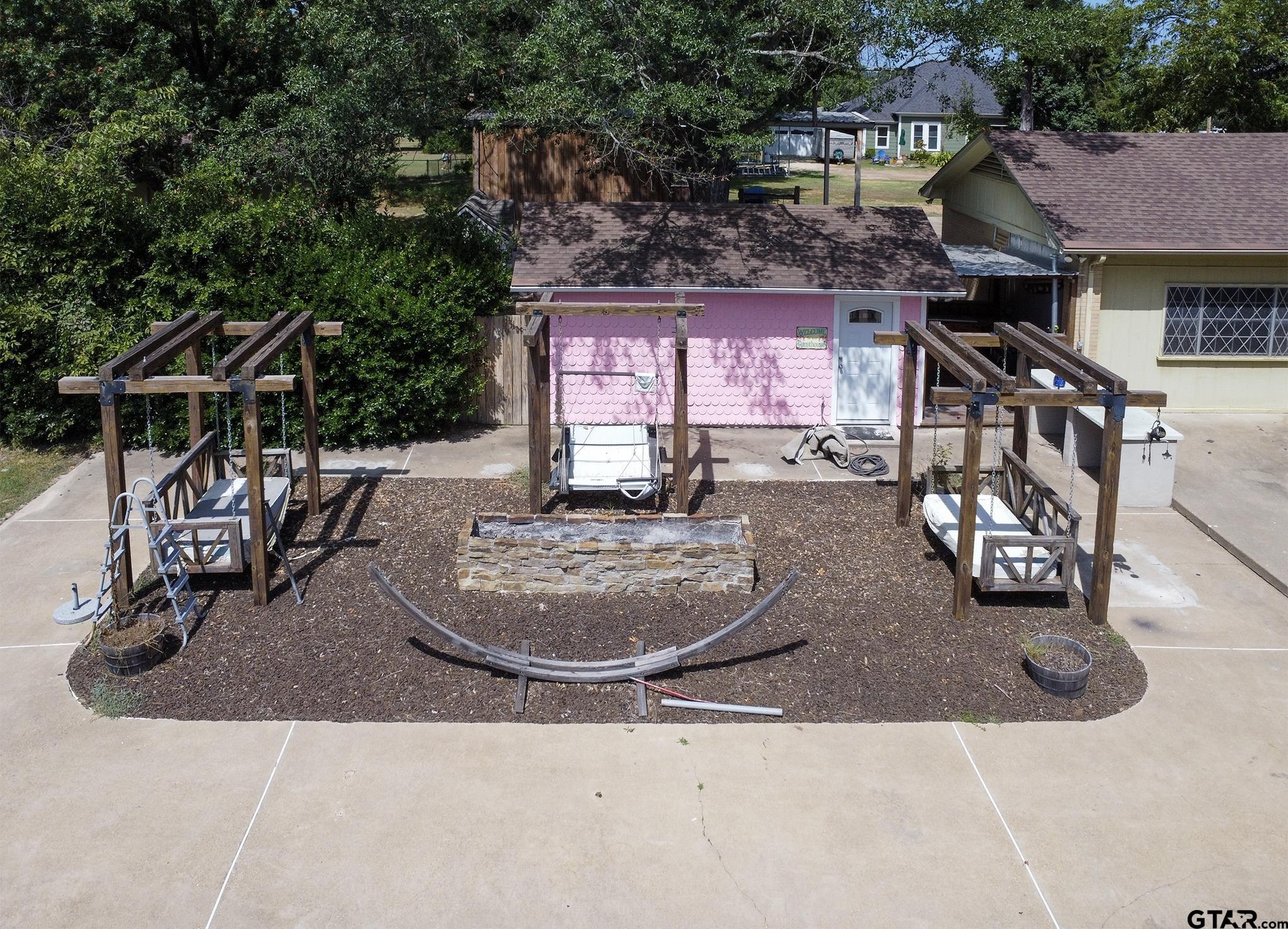 502 West Hubbard Street Lindale, TX 75771 - Photo 41 of 48 an outdoor space with seating