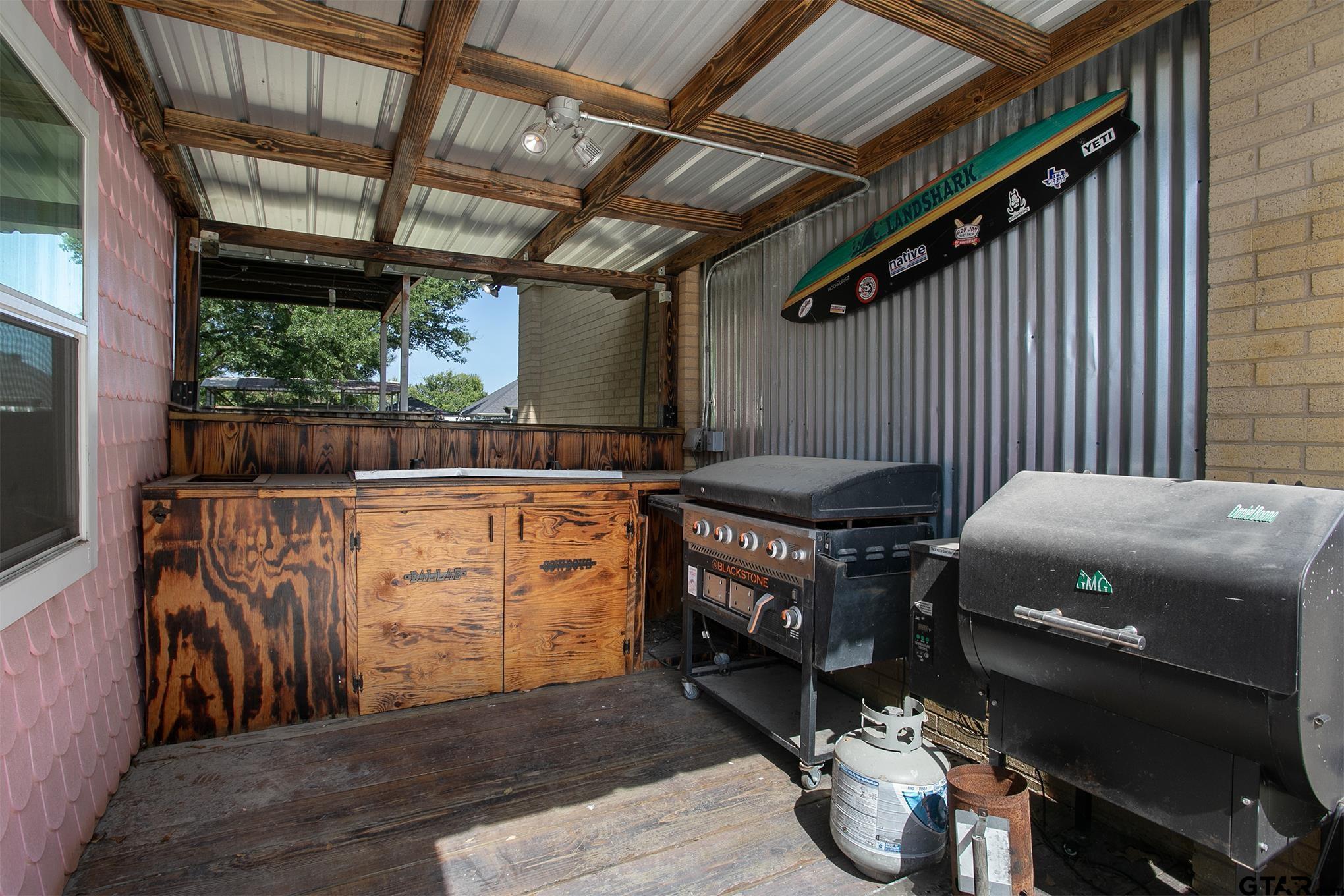 502 West Hubbard Street Lindale, TX 75771 - Photo 45 of 48 a view of a porch with furniture