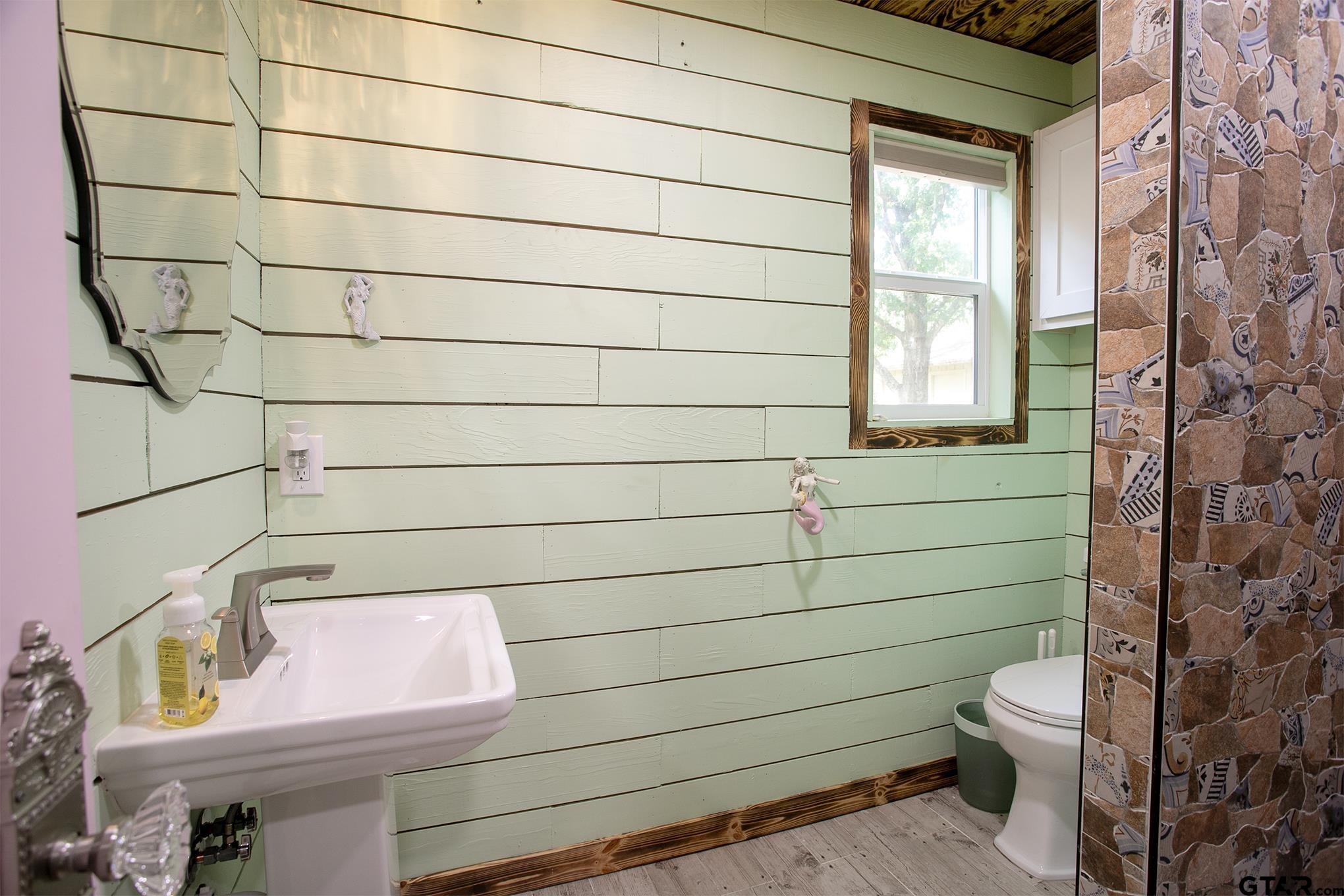 502 West Hubbard Street Lindale, TX 75771 - Photo 48 of 48 a bathroom with a toilet