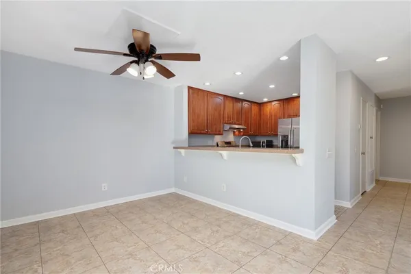 a view of a kitchen with a sink and cabinets