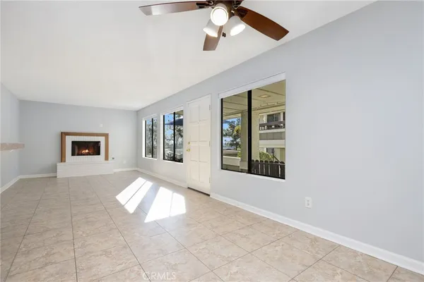 a view of an empty room with windows