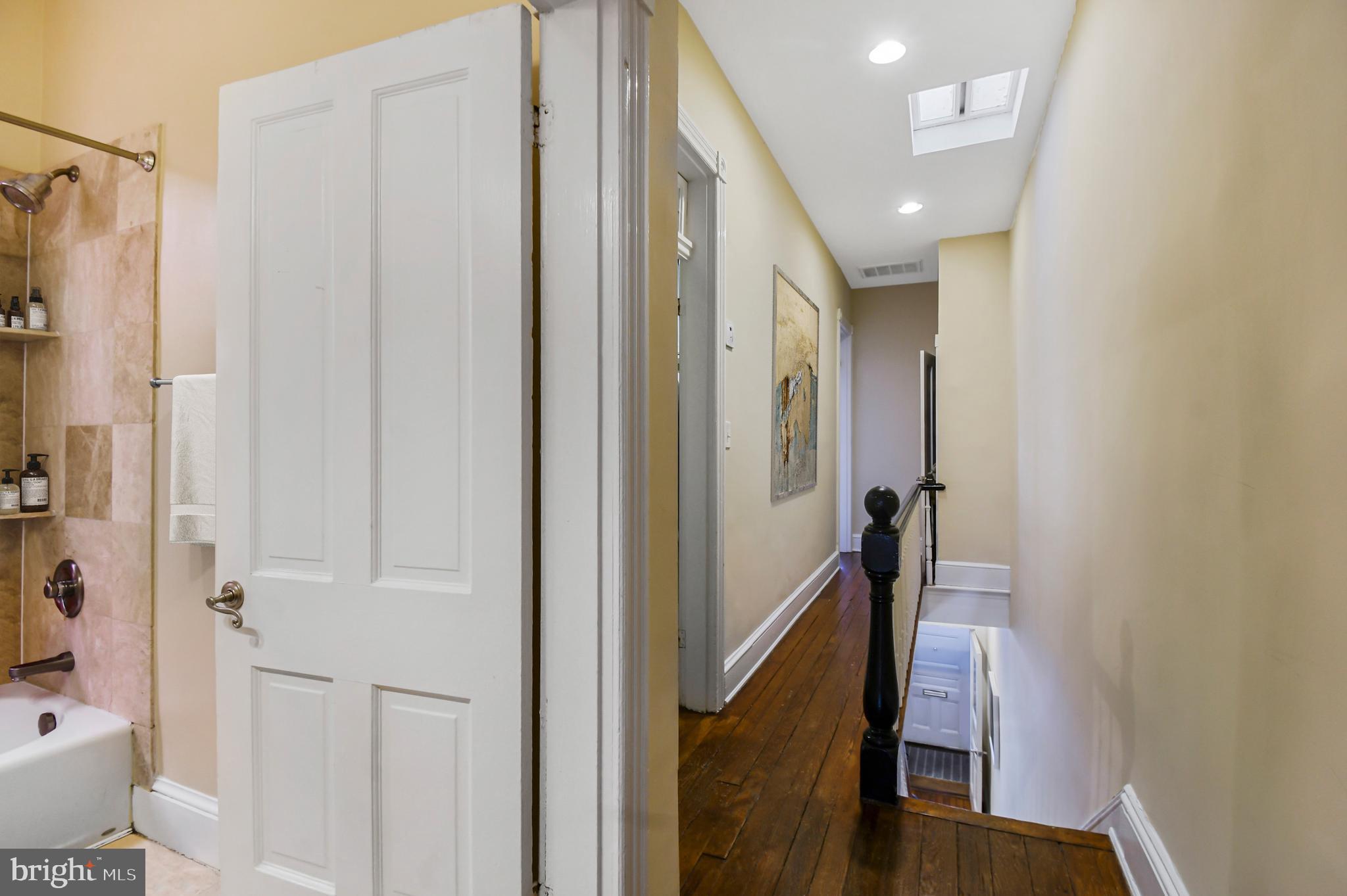 1330 35th Street Northwest Washington, DC 20007 - Photo 13 of 30 a view of a hallway with shower and fireplace