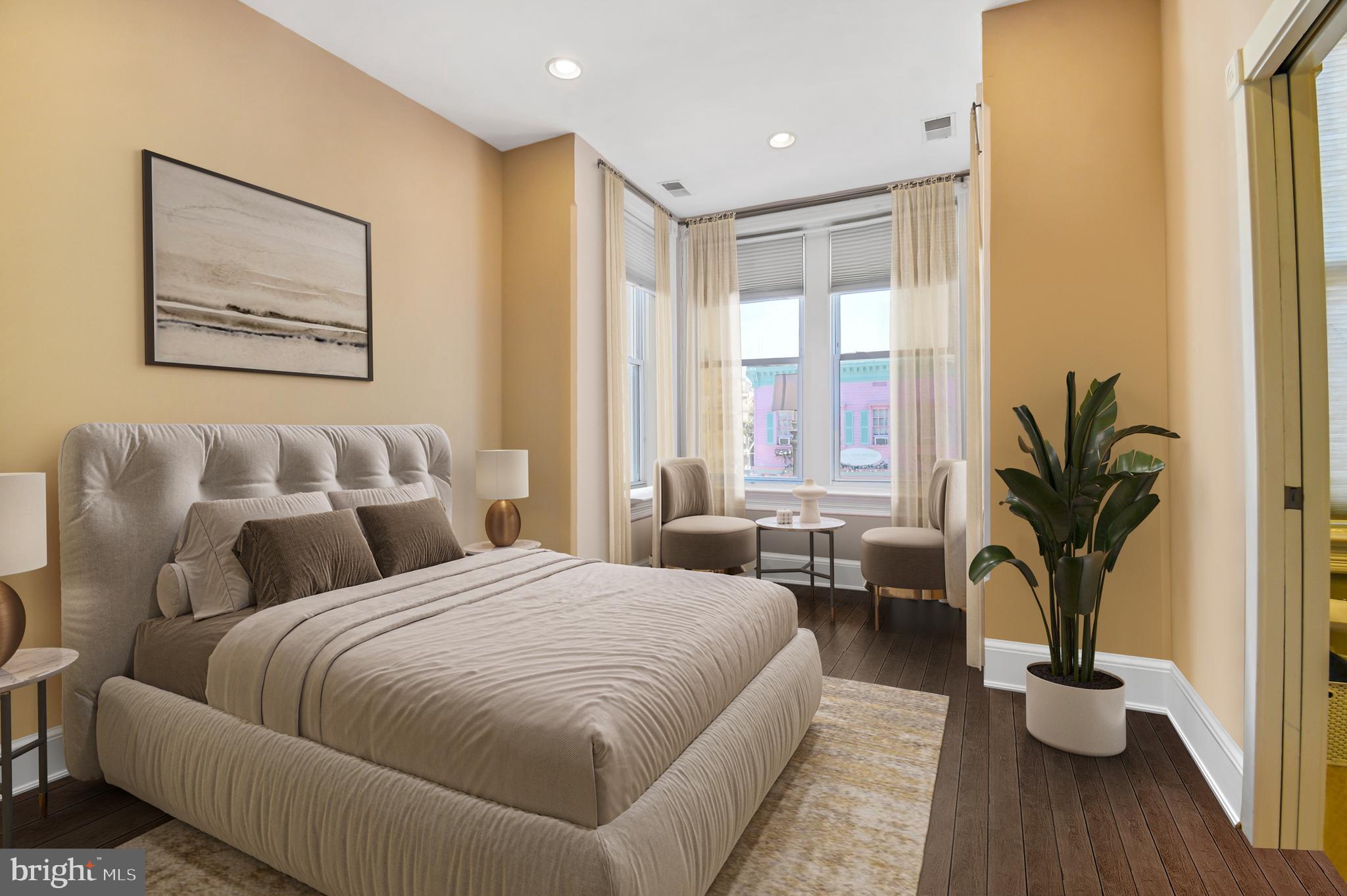 1330 35th Street Northwest Washington, DC 20007 - Photo 14 of 30 a bedroom with a large bed and a potted plant