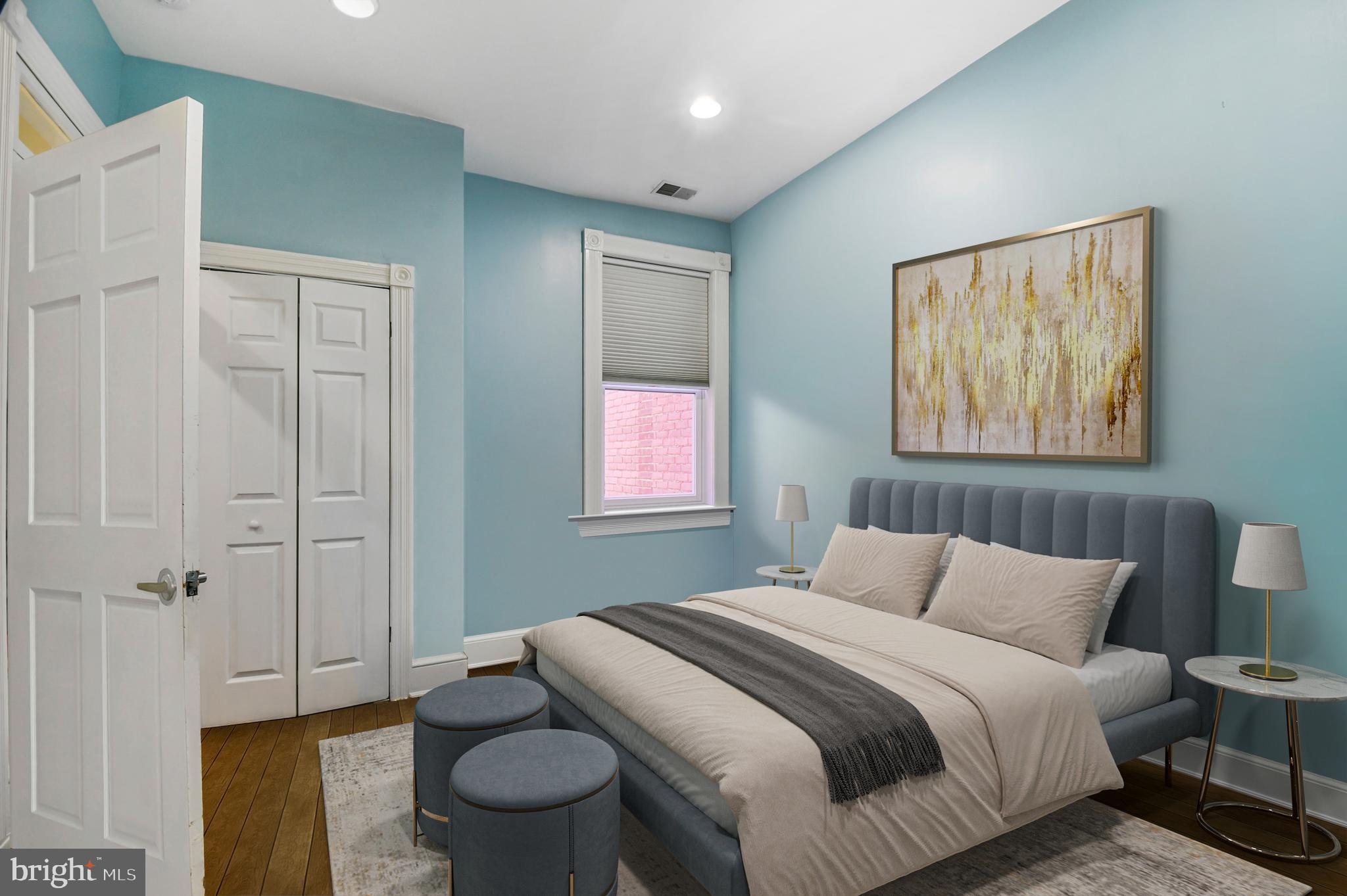 1330 35th Street Northwest Washington, DC 20007 - Photo 20 of 30 a bedroom with a bed and a painting on the wall