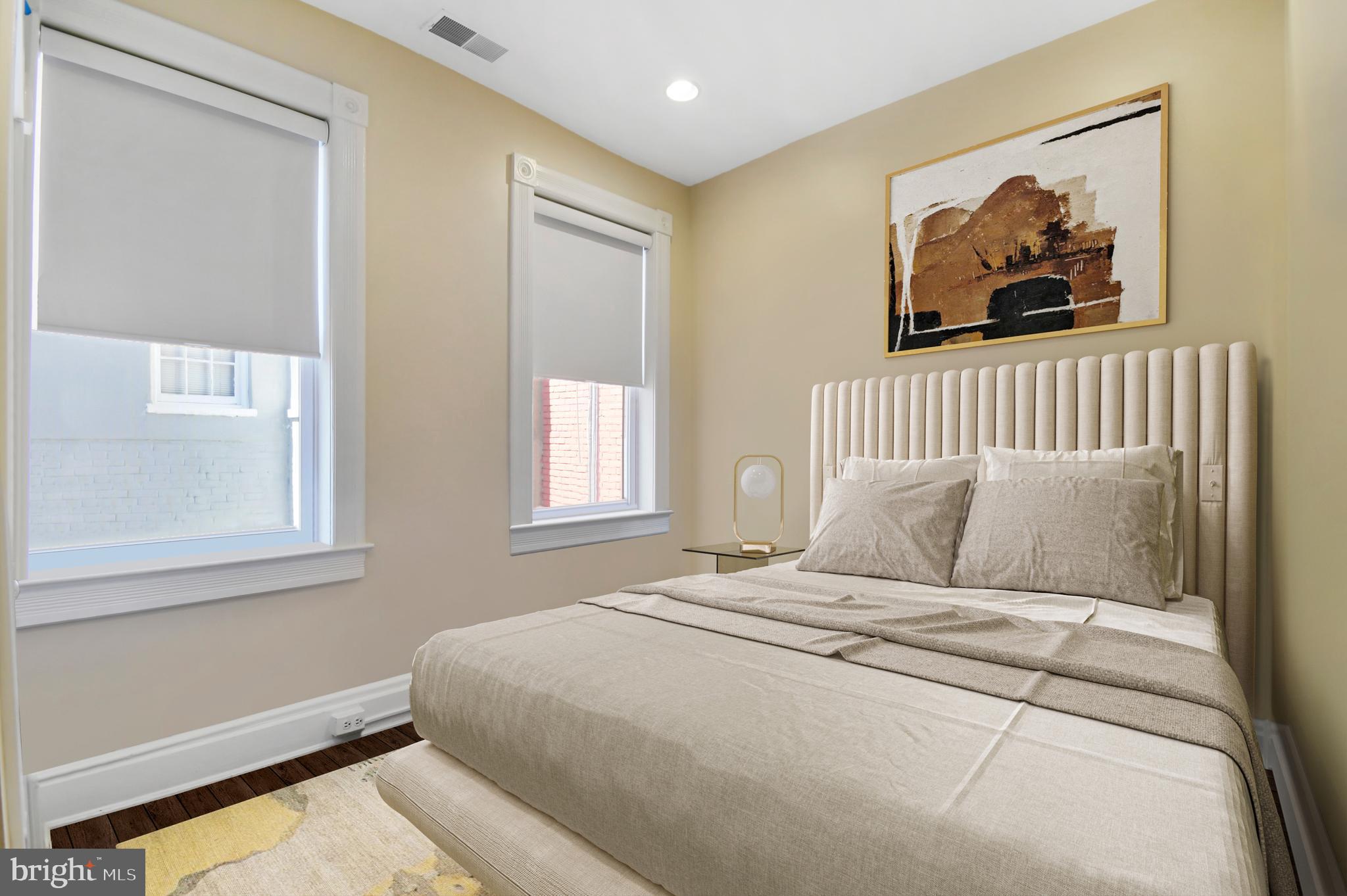 1330 35th Street Northwest Washington, DC 20007 - Photo 21 of 30 a bedroom with a large bed and a window
