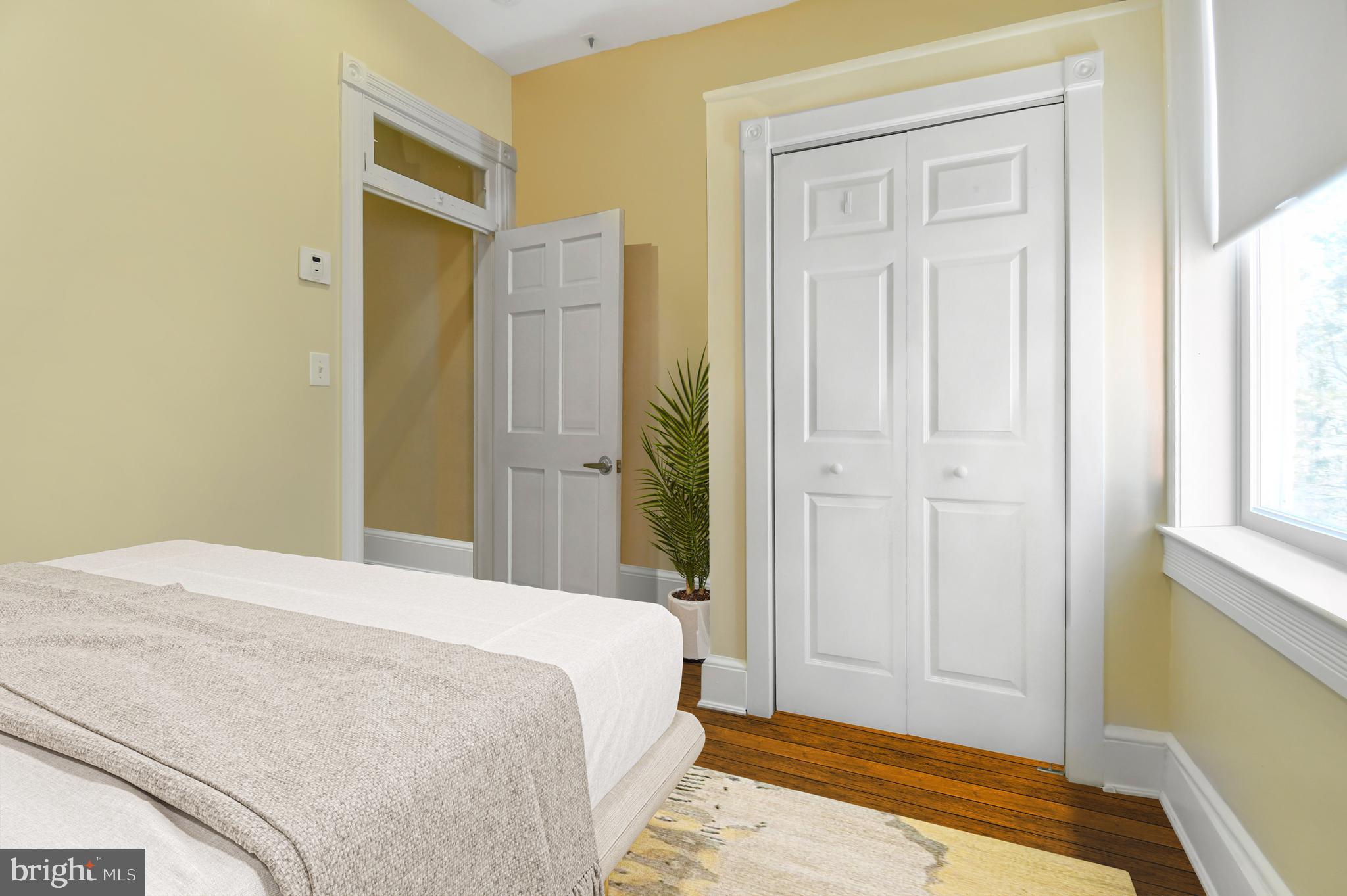 1330 35th Street Northwest Washington, DC 20007 - Photo 22 of 30 a bedroom with a bed and a window