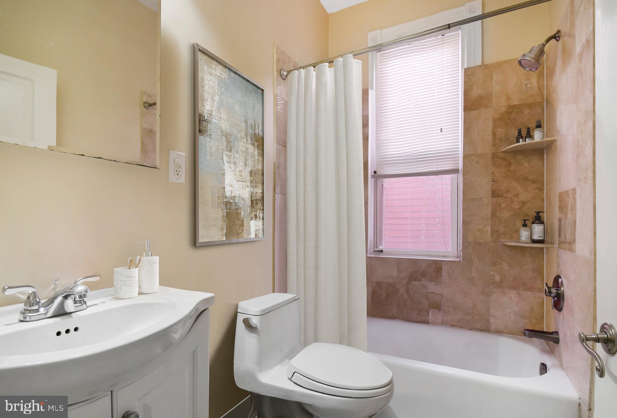 1330 35th Street Northwest Washington, DC 20007 - Photo 23 of 30 a bathroom with a sink toilet and shower
