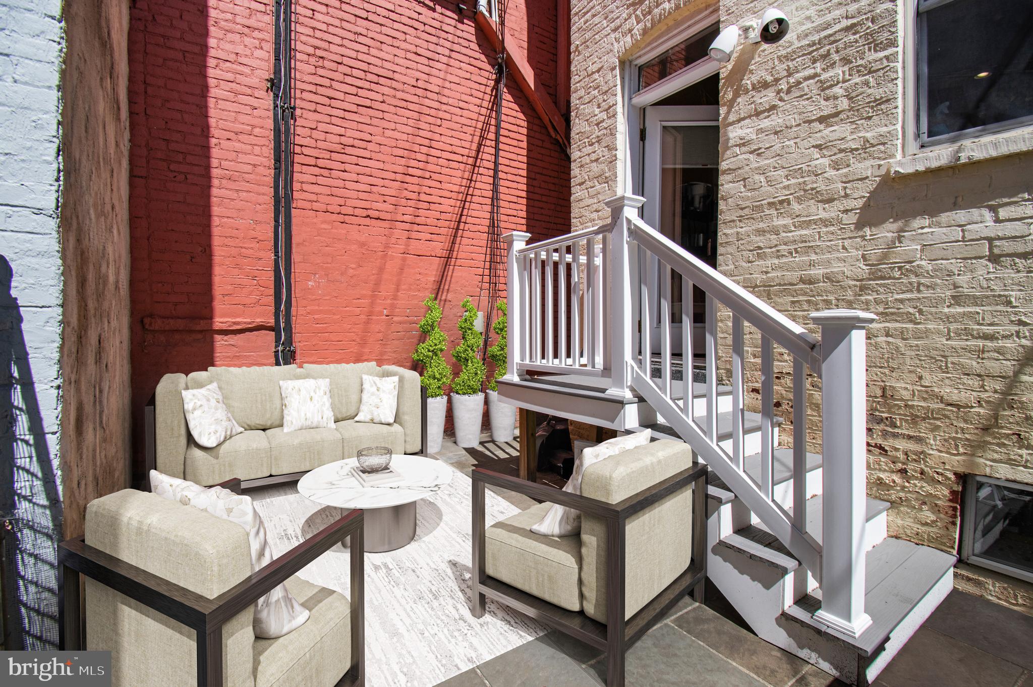 1330 35th Street Northwest Washington, DC 20007 - Photo 29 of 30 a view of a deck with couches and wooden floor