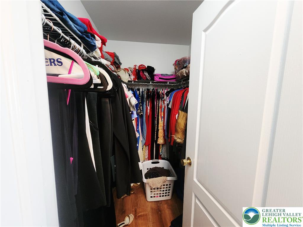 237 Ridings Circle Macungie, PA 18062 - Photo 36 of 70 A functional walk-in closet features built-in wire shelving and durable wood flooring.