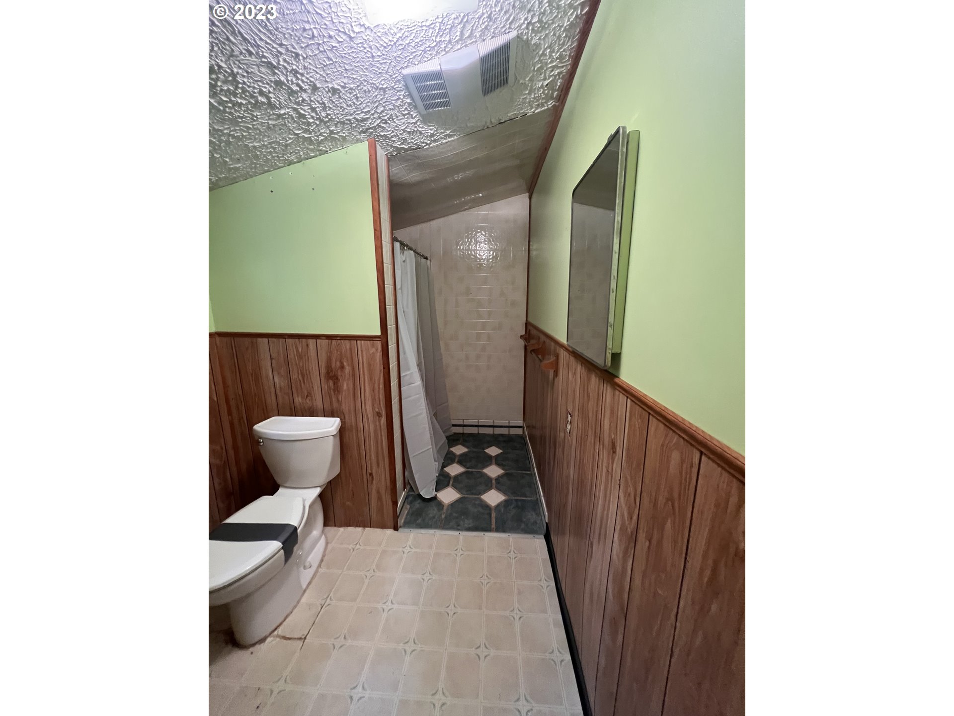 69946 Rhododendron Lane Rhododendron, OR 97049 - Photo 10 of 14 a bathroom with a toilet and a mirror