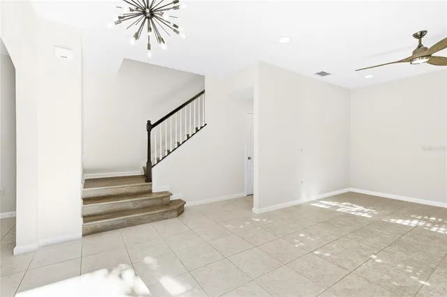 a view of an entryway with wooden floor and a chandelier