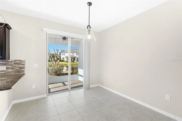 a kitchen with stainless steel appliances granite countertop a sink and a window