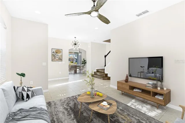 a living room with furniture and a table