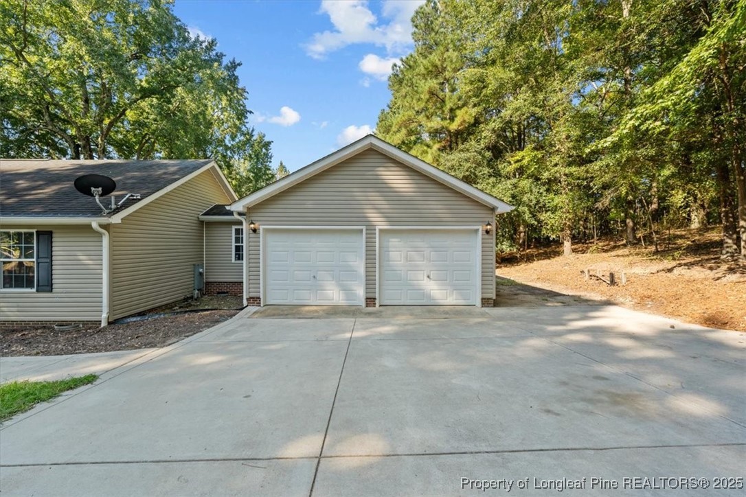 11891 Aberdeen Road Aberdeen, NC 28315 - Photo 26 of 35 a view of a house with a garage