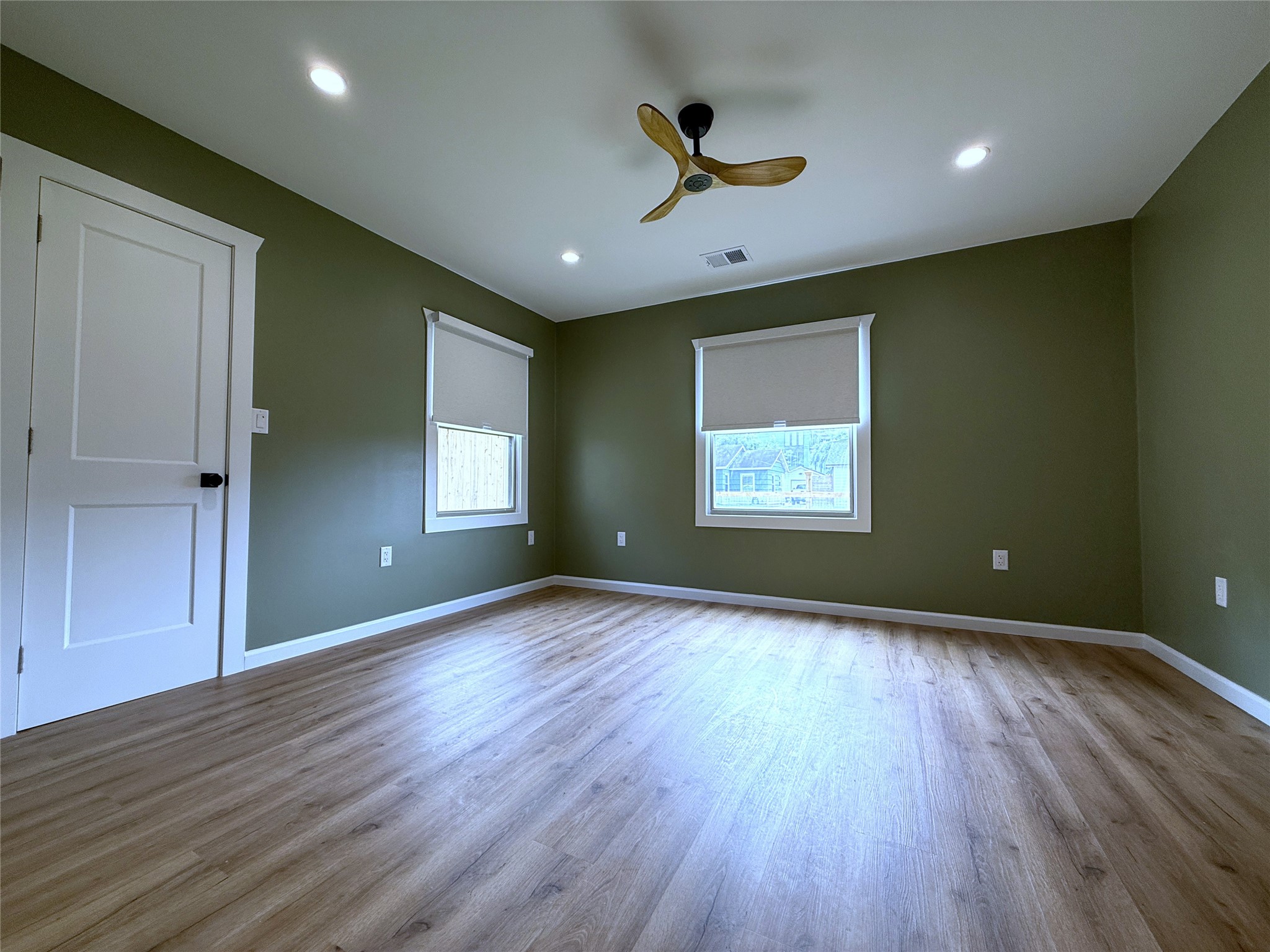 1922 Tabor Street Houston, TX 77009 - Photo 13 of 24 The front bedroom with recessed lighting & remote controlled ceiling fan.