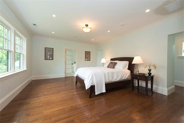 14 Winthrop Road Lexington, MA 02421 - Photo 16 of 30 a spacious bedroom with a bed and wooden floor