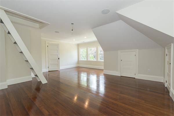 14 Winthrop Road Lexington, MA 02421 - Photo 23 of 30 wooden floor in an empty room with a window