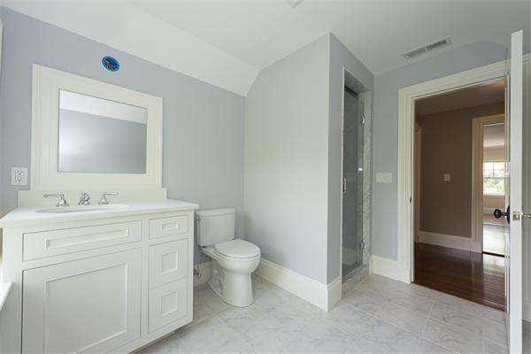 14 Winthrop Road Lexington, MA 02421 - Photo 24 of 30 a bathroom with a toilet sink and mirror