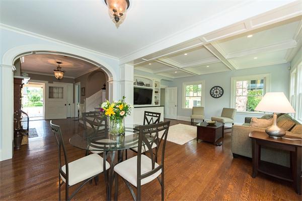 14 Winthrop Road Lexington, MA 02421 - Photo 5 of 30 a dining room with wooden floor a chandelier a glass table and chairs