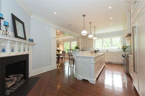 14 Winthrop Road Lexington, MA 02421 - Photo 9 of 30 a kitchen with a sink chandelier and living room view