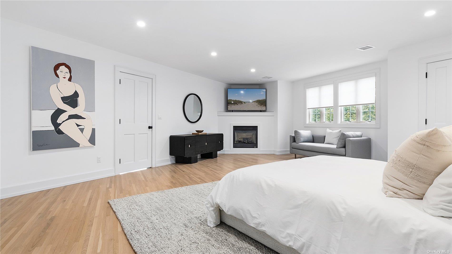 81 Skimhampton Road East Hampton, NY 11937 - Photo 15 of 24 a bed room with a bed and a fireplace