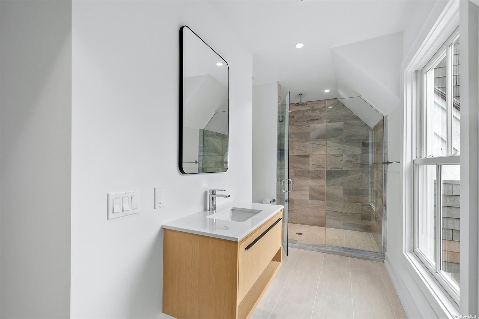 81 Skimhampton Road East Hampton, NY 11937 - Photo 18 of 24 a bathroom with a shower sink and mirror