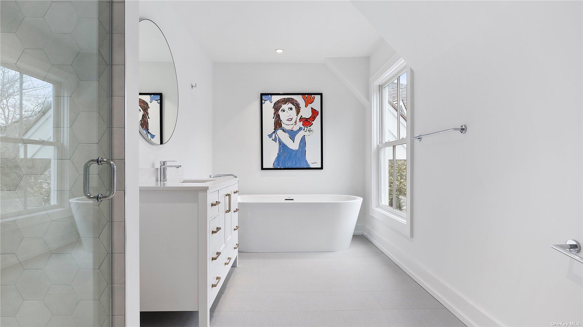 81 Skimhampton Road East Hampton, NY 11937 - Photo 20 of 24 a bathroom with a tub sink and mirror