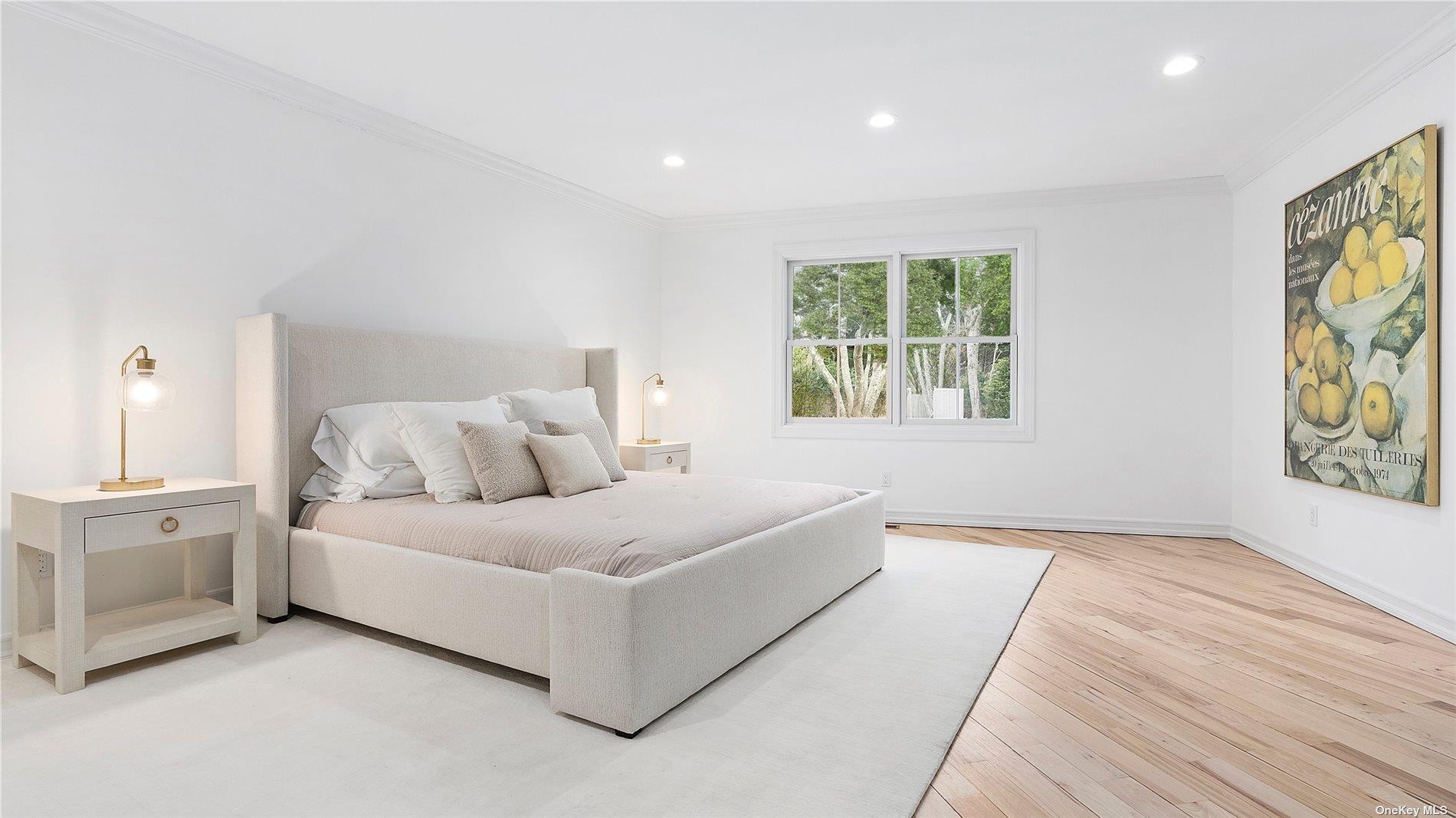 81 Skimhampton Road East Hampton, NY 11937 - Photo 8 of 24 a spacious bedroom with a large bed and a window