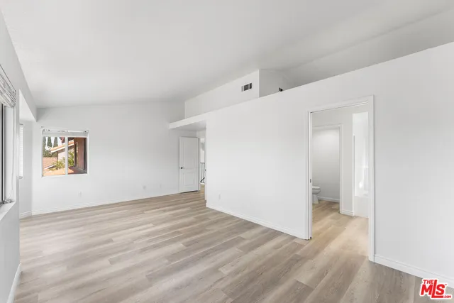 a bathroom with double vanity sink a mirror and shower