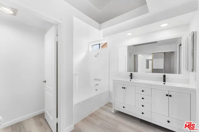 a bathroom with a shower and a toilet