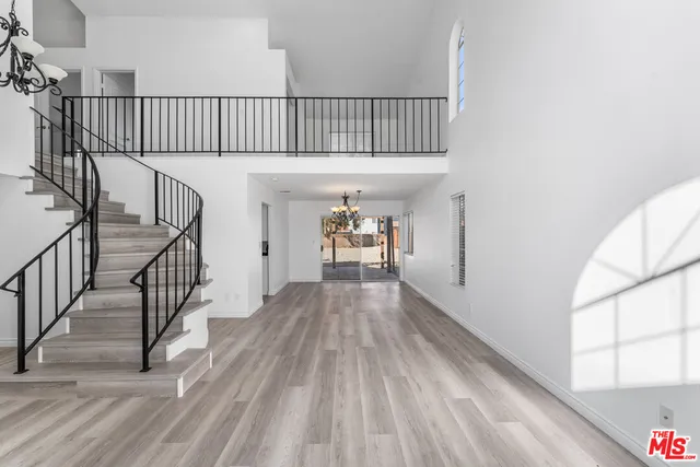 a view of gallery with wooden floor