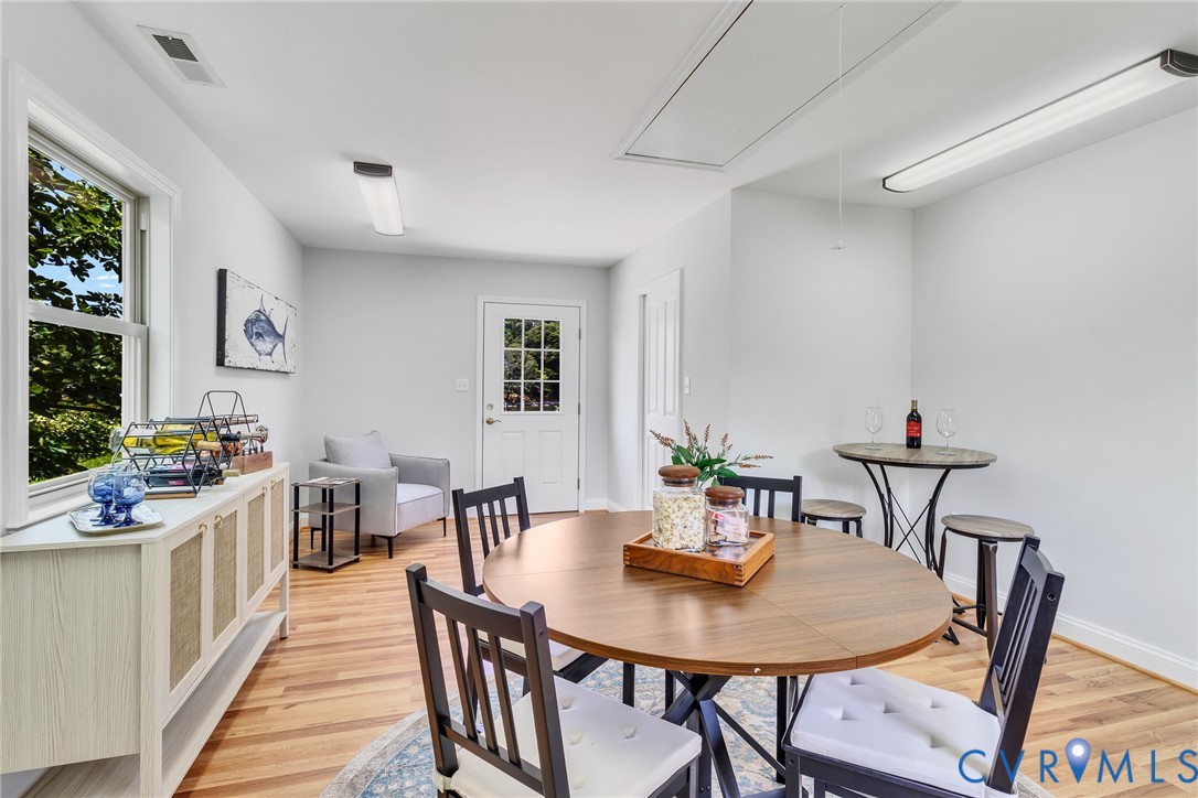 618 Main Street Reedville, VA 22539 - Photo 28 of 54 Bright room featuring wood-finish flooring, white