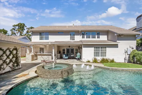 a front view of house with yard and outdoor seating