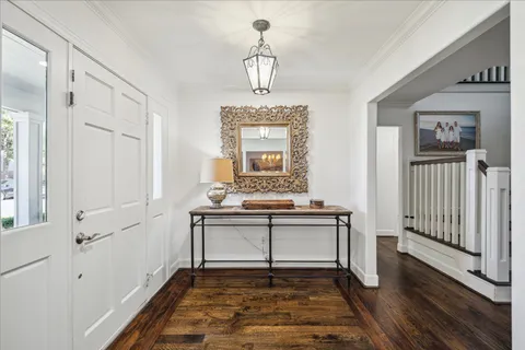 a view of hall way with furniture