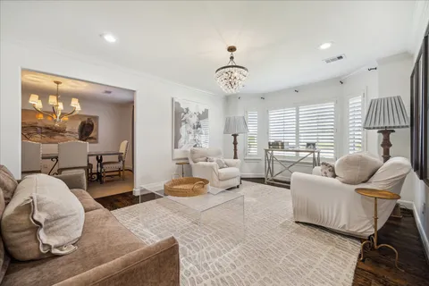 a bedroom with furniture and a large window