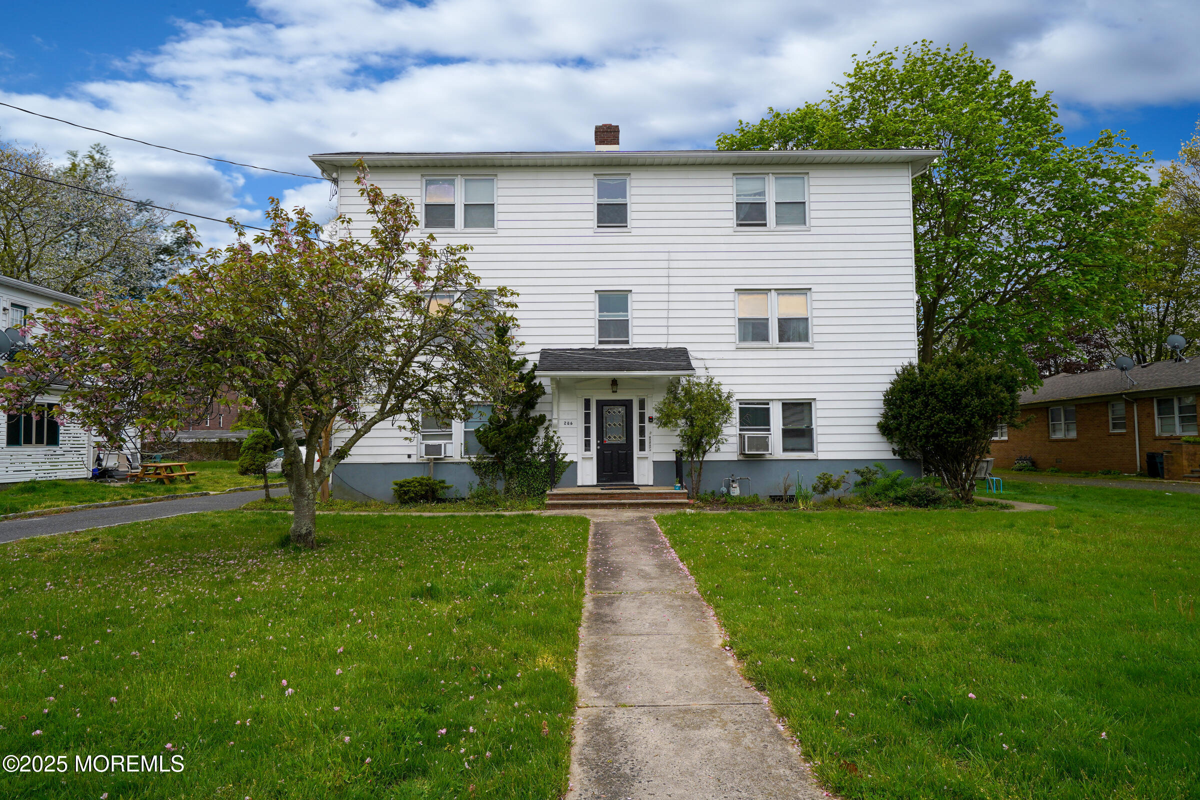 286 Cleveland Avenue, Unit 1 Long Branch, NJ 07740 - Photo 10 of 10 a view of a house with a yard