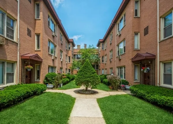 a view of a building with a yard